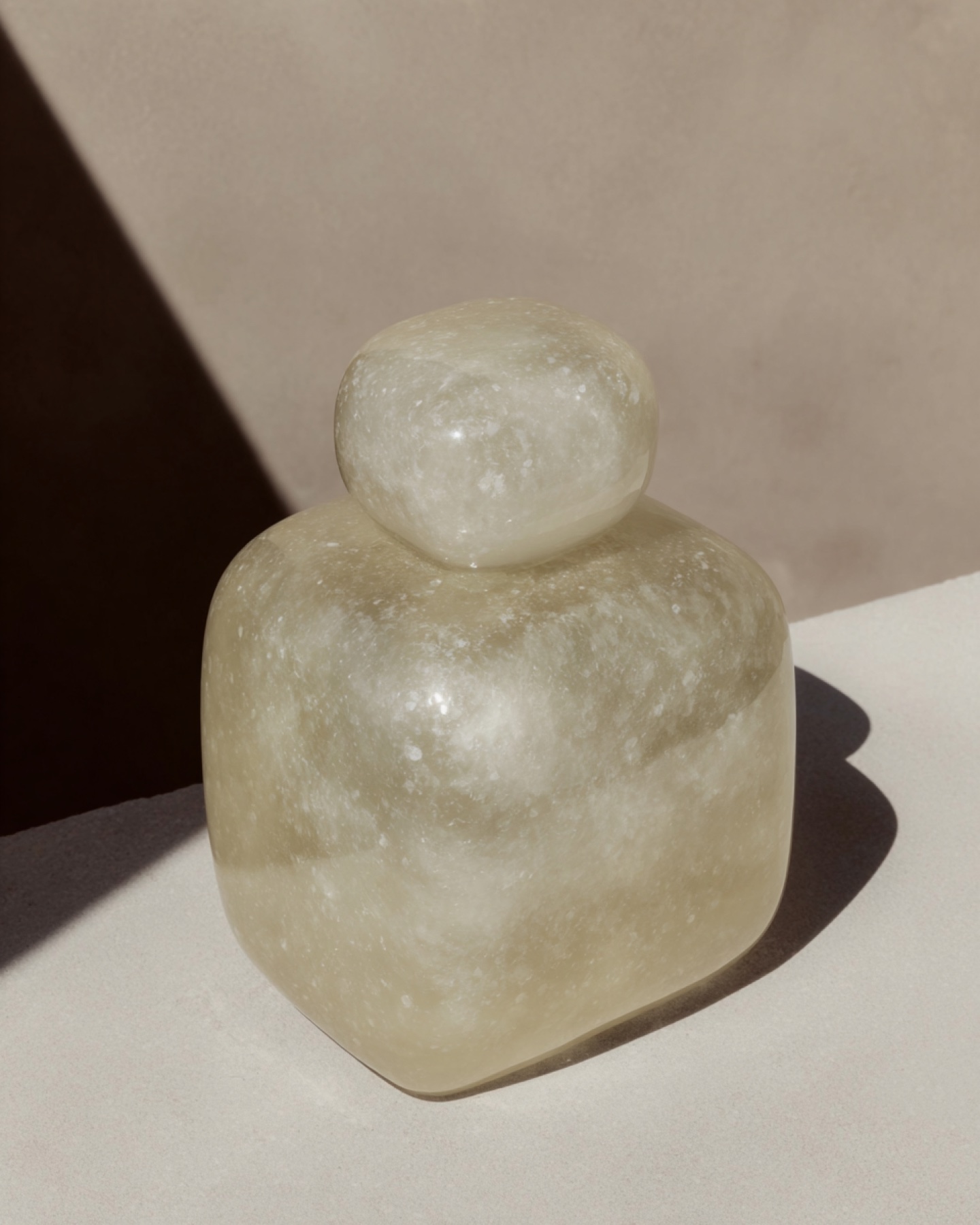 Sculptural stone product photographed in architectural light